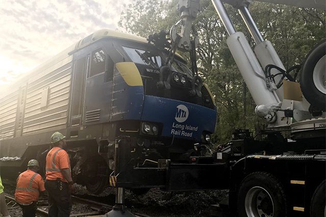 The derailed train being removed from the tracks